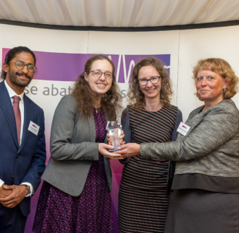 Jennie Bushell, Wonderseekers (middle-left), and Dr Sarah Payne, University of Surrey (middle-right) collecting their award.