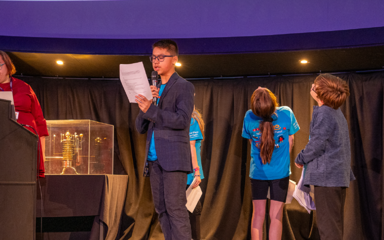 A member of the Young Design Panel presenting in the Planetarium.